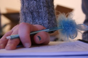 Writing the three words.